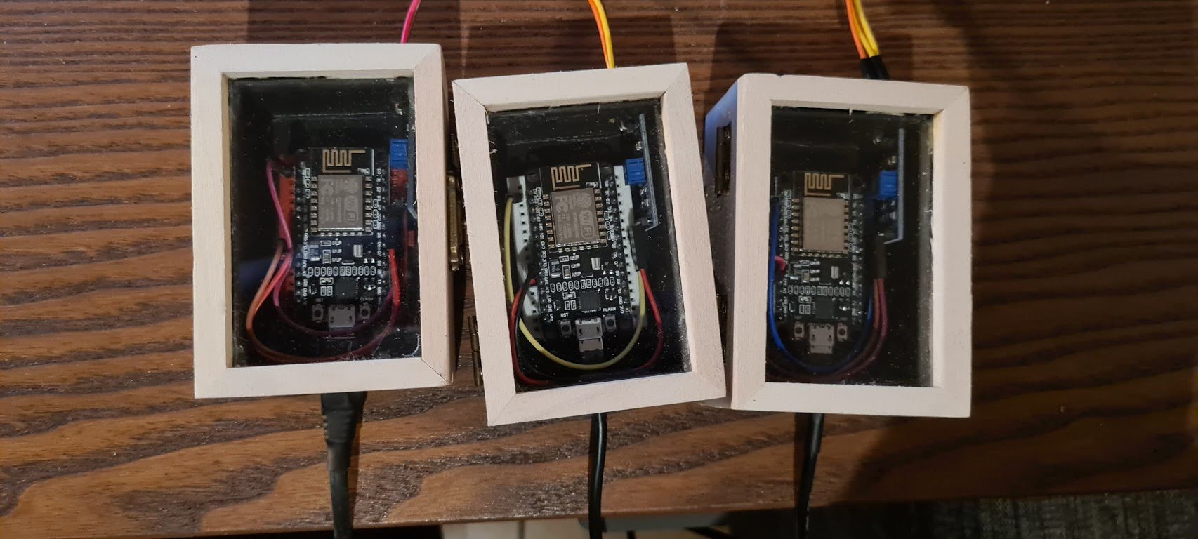 ESP8266 controllers enclosed in wooden boxes